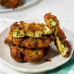 A plate of golden-brown vegetable fritters.